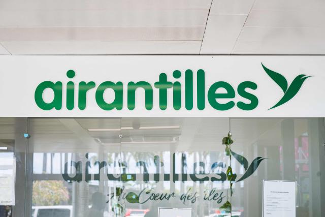 This photograph taken in Les Abymes, on the French Caribbean island of Guadeloupe on April 30, 2026, shows a closed office of French regional airline Air Antilles at Maryse Conde airport's regional terminal. The regional airline, which had been serving the French Caribbean islands (Saint Barthélemy, Saint Martin, Guadeloupe and Martinique) since 2002, had been facing a series of setbacks for several years. On April 27, 2026, the Commercial Court of Pointe-à-Pitre (Guadeloupe) placed Air Antilles into administration, due to the lack of a takeover bid deemed credible. (Photo by Carla Bernhardt / AFP)