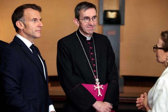 France's President Emmanuel Macron and Hugues de Woillemont, directeur general of L’Њuvre d’Orient, visit the Matenadaran museum, Armenia's cultural institution which houses the vast collection of ancient manuscripts, in Yerevan on May 5, 2026. (Photo by Ludovic MARIN / AFP)