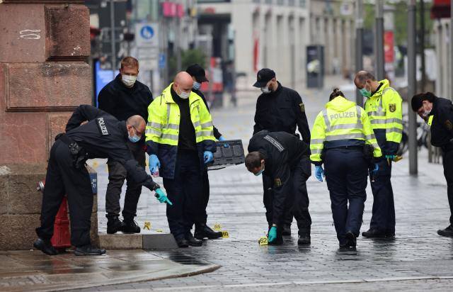 Police investigators work at the scene, one day after a car ploughed into people on a street leaving at least two dead and several injured, in the city centre in Leipzig, eastern Germany, on May 5, 2026. The driver, a 33-year-old German man, was arrested on May 4 at the scene and officials said his motivation was unclear. Germany has been shaken by a series of car-ramming attacks in recent years, including one targeting a Christmas market in 2024 in Magdeburg, and also in Berlin and Munich. (Photo by Jens SCHLUETER / AFP)