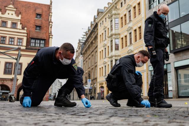 Police investigators work at the scene, one day after a car ploughed into people on a street leaving at least two dead and several injured, in the city centre in Leipzig, eastern Germany, on May 5, 2026. The driver, a 33-year-old German man, was arrested on May 4 at the scene and officials said his motivation was unclear. Germany has been shaken by a series of car-ramming attacks in recent years, including one targeting a Christmas market in 2024 in Magdeburg, and also in Berlin and Munich. (Photo by Jens SCHLÜTER / AFP)