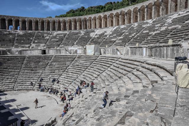 Tourists visit the ancient amphitheater of Aspendos, part of the ancient Greco-Roman city in Antalya province, in Antalya on May 4, 2026. (Photo by Adem ALTAN / AFP)