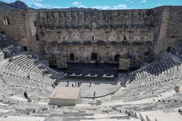 Tourists visit the ancient amphitheater of Aspendos, part of the ancient Greco-Roman city in Antalya province, in Antalya on May 4, 2026. (Photo by Adem ALTAN / AFP)