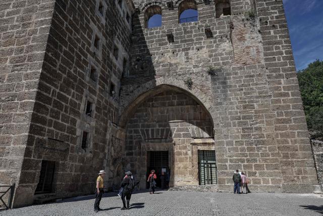 Tourists visit the ancient amphitheater of Aspendos, part of the ancient Greco-Roman city in Antalya province, in Antalya on May 4, 2026. (Photo by Adem ALTAN / AFP)