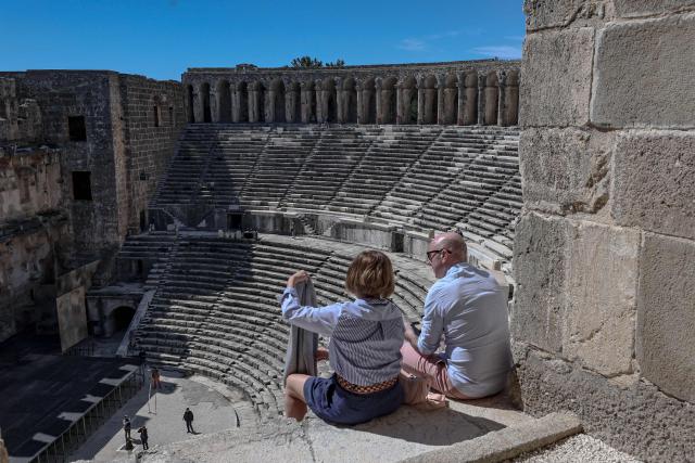 Tourists visit the ancient amphitheater of Aspendos, part of the ancient Greco-Roman city in Antalya province, in Antalya on May 4, 2026. (Photo by Adem ALTAN / AFP)