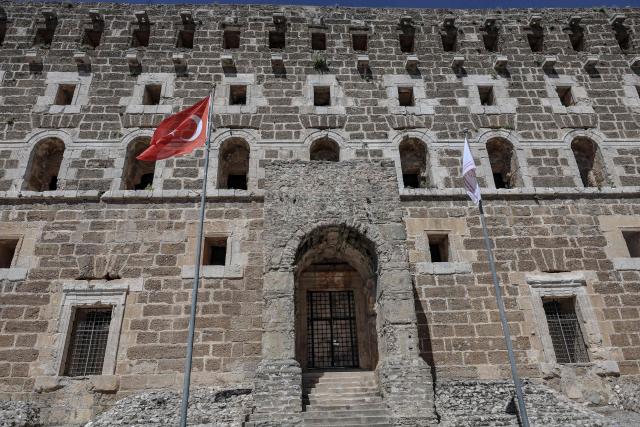 This photograph shows a view of the entrance of the ancient amphitheater of Aspendos, part of the ancient Greco-Roman city in Antalya province, in Antalya on May 4, 2026. (Photo by Adem ALTAN / AFP)