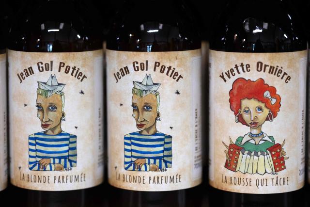 This photograph taken in Bannalec, western France on May 5, 2026 shows bottles of beers named 'Jean Gol Potier' and 'Yvette Orniere', play on words in reference to French fashion designer Jean-Paul Gaultier and French accordionist and pianist Yvette Horner displayed at the brewery 'Brasserie de l'imprimerie'. Following a formal notice from Yoko Ono, the widow of the Beatles singer, a Breton brewery has sold several thousand bottles of ‘John Lemon’ beer in just a few days – beer it will no longer be able to sell after July 1, 2026, the brewer told AFP on May 5, 2026. At the end of March, a Dutch law firm served the brewery with a formal notice to cease marketing ‘John Lemon’, failing which it would face having to pay substantial sums to the Yoko Ono Trust, which is responsible for protecting John Lennon’s image. (Photo by Fred TANNEAU / AFP)