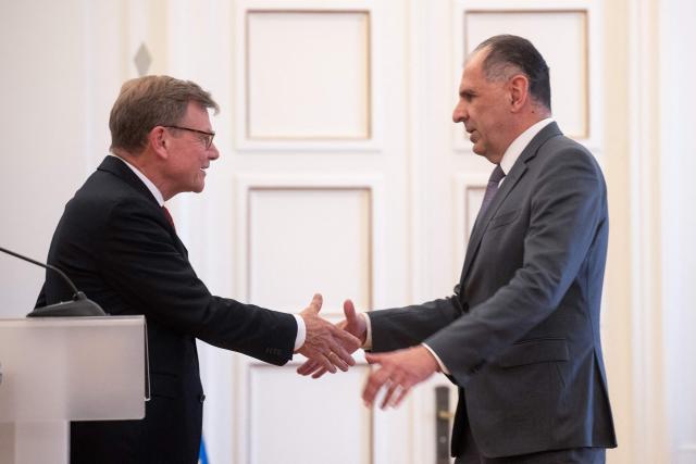 German Foreign Minister Johann Wadephul (L) shake hands with Greek Foreign Minister George Gerapetritis after a press conference at the Ministry of Foreign Affairs in Athens, on May 4, 2026. (Photo by Angelos TZORTZINIS / AFP)