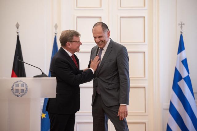 German Foreign Minister Johann Wadephul (L) gestures with Greek Foreign Minister George Gerapetritis after a press conference at the Ministry of Foreign Affairs in Athens, on May 4, 2026. (Photo by Angelos TZORTZINIS / AFP)