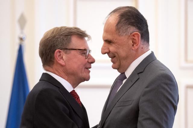 German Foreign Minister Johann Wadephul (L) speaks with Greek Foreign Minister George Gerapetritis after a press conference at the Ministry of Foreign Affairs in Athens, on May 4, 2026. (Photo by Angelos TZORTZINIS / AFP)