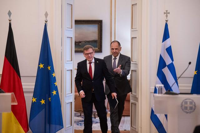 German Foreign Minister Johann Wadephul (L) arrives with Greek Foreign Minister George Gerapetritis for a press conference at the Ministry of Foreign Affairs in Athens, on May 4, 2026. (Photo by Angelos TZORTZINIS / AFP)