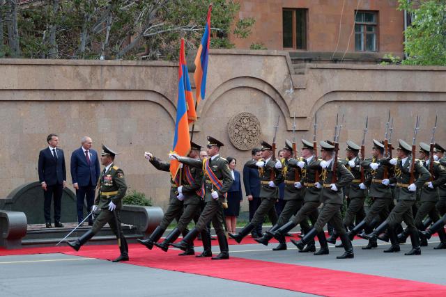 France's President Emmanuel Macron and Armenia's Prime Minister Nikol Pashinyan attend a welcoming ceremony prior to their talks in Yerevan on May 5, 2026. (Photo by Ludovic MARIN / AFP)