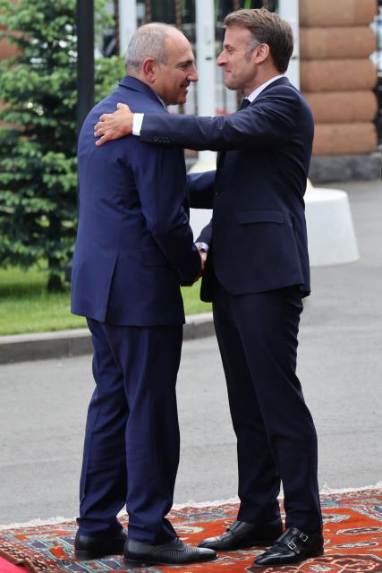 France's President Emmanuel Macron and Armenia's Prime Minister Nikol Pashinyan greet each other prior to their talks in Yerevan on May 5, 2026. (Photo by Ludovic MARIN / AFP)