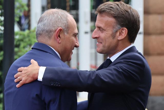 France's President Emmanuel Macron and Armenia's Prime Minister Nikol Pashinyan greet each other prior to their talks in Yerevan on May 5, 2026. (Photo by Ludovic MARIN / AFP)