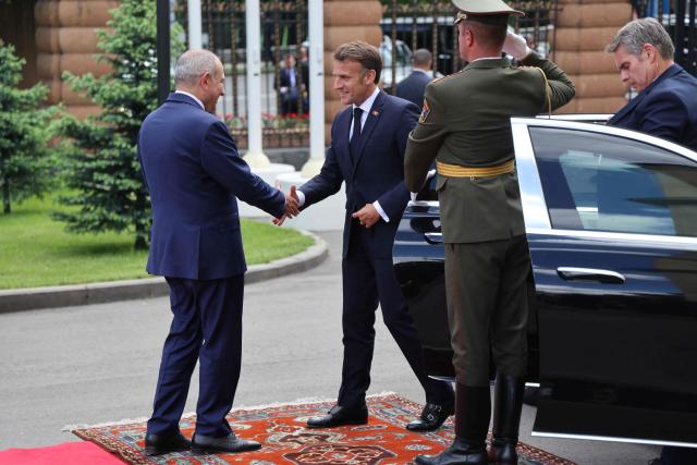 France's President Emmanuel Macron and Armenia's Prime Minister Nikol Pashinyan greet each other prior to their talks in Yerevan on May 5, 2026. (Photo by Ludovic MARIN / AFP)