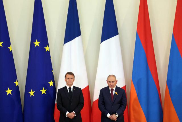 France's President Emmanuel Macron and Armenia's Prime Minister Nikol Pashinyan attend a ceremony to sign agreements during their talks in Yerevan on May 5, 2026. (Photo by Ludovic MARIN / AFP)