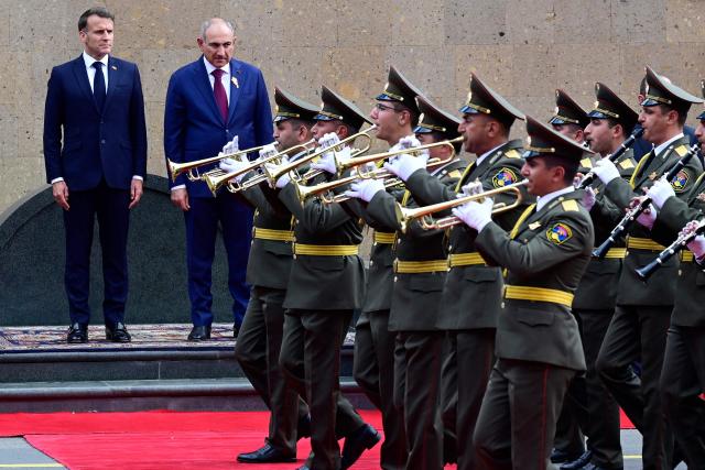 France's President Emmanuel Macron and Armenia's Prime Minister Nikol Pashinyan attend a welcoming ceremony prior to their talks in Yerevan on May 5, 2026. (Photo by KAREN MINASYAN / AFP)