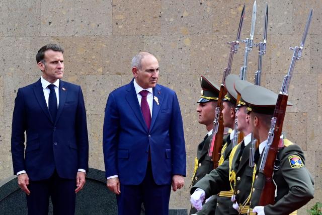 France's President Emmanuel Macron and Armenia's Prime Minister Nikol Pashinyan attend a welcoming ceremony prior to their talks in Yerevan on May 5, 2026. (Photo by KAREN MINASYAN / AFP)