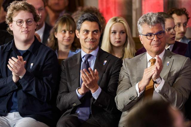 Dutch Prime Minister Rob Jetten (C) and and King's Commissioner for the province of Utrecht Hans Oosters (R) attend the National Liberation Day ceremony, held at the Academy building in Utrecht on May 5, 2026 to mark the end of the German occupation in 1945. (Photo by Freek van den Bergh / ANP / AFP) / Netherlands OUT