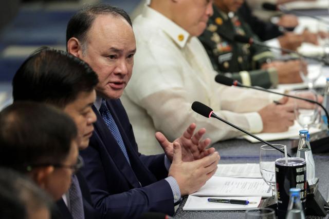 Philippines' Defense Secretary Gilbert Teodoro Jr. (C) speaks during a bilateral meeting with Japan's Defense Minister Shinjiro Koizumi in Manila on May 5, 2026.  (Photo by MARK CRISTINO / AFP)