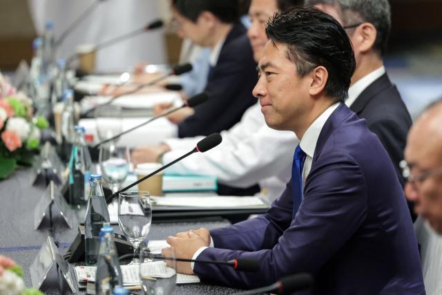 Japan's Defense Minister Shinjiro Koizumi takes part in a bilateral meeting with Philippines' Defense Secretary Gilbert Teodoro Jr. in Manila on May 5, 2026.  (Photo by MARK CRISTINO / AFP)