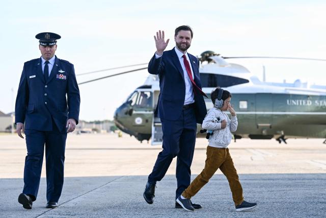 US Vice President JD Vance and his son Vivek walk to board Air Force Two at Joint Base Andrews, Maryland on May 5, 2026. Vance is traveling to Ohio, Oklahoma, and Iowa. (Photo by Roberto Schmidt / POOL / AFP)