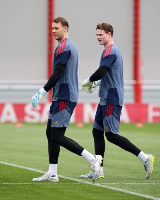 Bayern Munich's German goalkeeper #01 Manuel Neuer (L) and Bayern Munich's German goalkeeper #40 Jonas Urbig walk across the pitch during a training session of FC Bayern Munich at their training ground in the Saebener Strasse in Munich, southern Germany on May 5, 2026, the eve of the UEFA Champions League second-leg semi-final football match against Paris Saint-Germain (PSG). (Photo by Alexandra BEIER / AFP)