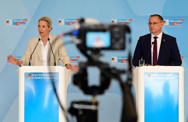 The co-leaders of Germany's far-right Alternative for Germany (AfD) party Alice Weidel (L) and Tino Chrupalla address a press conference on May 5, 2026 in Berlin, following a meeting of their party's parliamentary group. (Photo by John MACDOUGALL / AFP)