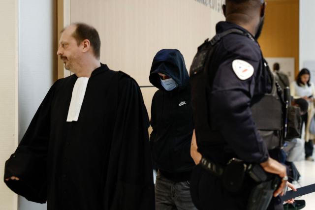 An after-school club leader at a primary school accused of allegedly sexually assaulting minors arrives in court for his trial at the Paris courthouse, in Paris on May 5, 2026. The 47-year-old youth worker at a Parisian school stands trial in the first case of violence in after-school programs since the scandal broke in the French capital. He is appearing in court on charges of allegedly sexually harassing nine girls and sexually assaulting three of them, offenses that carry a potential sentence of up to ten years in prison and a fine of 150,000. (Photo by Kenzo TRIBOUILLARD / AFP)