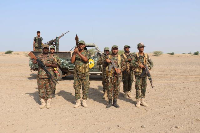 Forces affiliated with the legitimate government take part in a military exercise on the coasts of Al-Khokha area in Yemen's Hodeidah governorate on May 5, 2026. (Photo by Khaled ZIAD / AFP)