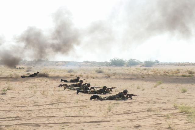 Forces affiliated with the legitimate government take part in a military exercise on the coasts of Al-Khokha area in Yemen's Hodeidah governorate on May 5, 2026. (Photo by Khaled ZIAD / AFP)