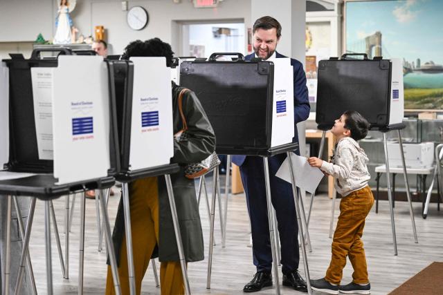 US Vice President JD Vance, alongside his son Vivek, votes at a polling location at St. Anthony of Padua Maronite Catholic Church in the state's primary election, in Cincinnati, Ohio on May 5, 2026. Vance is stopping in Ohio to vote in the state's primary election before continuing on to Oklahoma and Iowa. (Photo by Roberto Schmidt / POOL / AFP)