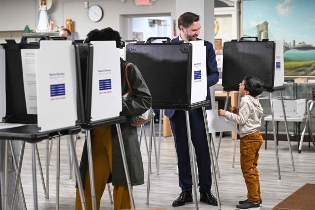 US Vice President JD Vance, alongside his son Vivek, votes at a polling location at St. Anthony of Padua Maronite Catholic Church in the state's primary election, in Cincinnati, Ohio on May 5, 2026. Vance is stopping in Ohio to vote in the state's primary election before continuing on to Oklahoma and Iowa. (Photo by Roberto Schmidt / POOL / AFP)