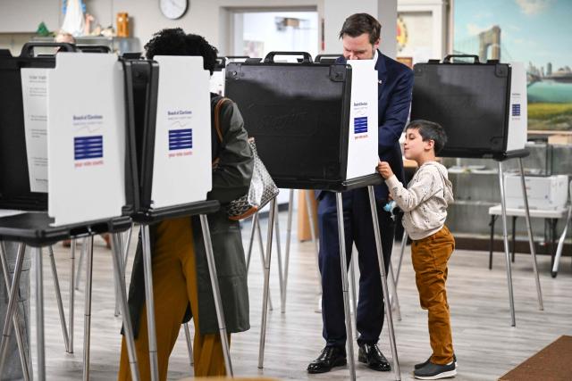 US Vice President JD Vance, alongside his son Vivek, votes at a polling location at St. Anthony of Padua Maronite Catholic Church in the state's primary election, in Cincinnati, Ohio on May 5, 2026. Vance is stopping in Ohio to vote in the state's primary election before continuing on to Oklahoma and Iowa. (Photo by Roberto Schmidt / POOL / AFP)