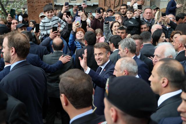 France's President Emmanuel Macron is greeted by people in Gyumri on May 5, 2026. (Photo by Ludovic MARIN / AFP)