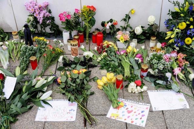 Flowers, candles and messages have been placed at a makeshift memorial in front of the Paulinum (University Auditorium and St Pauli University Church) in Leipzig, eastern Germany, on May 5, 2026, close to the site where a car ploughed into people on a street, leaving at least two dead and several injured, one day after the incident. A man suspected of ploughing a car into a crowd in the eastern German city of Leipzig, killing two people, recently underwent treatment in a psychiatric hospital, the authorities said on May 5. The German national allegedly drove the vehicle on May 4 at high speed down a main street in the historic centre of the eastern city, leaving two people dead and many others wounded. The 33-year-old suspect was arrested at the scene and officials have said they do not believe he had a political or religious motive. (Photo by Jens SCHLÜTER / AFP)