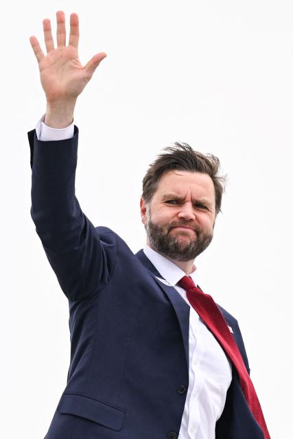 US Vice President JD Vance waves as he boards Air Force Two as he departs from Cincinnati/Northern Kentucky International Airport in Hebron, Kentucky on May 5, 2026. Vance stopped in Ohio to vote in the state's primary election before continuing on to Oklahoma and Iowa. (Photo by Roberto Schmidt / POOL / AFP)