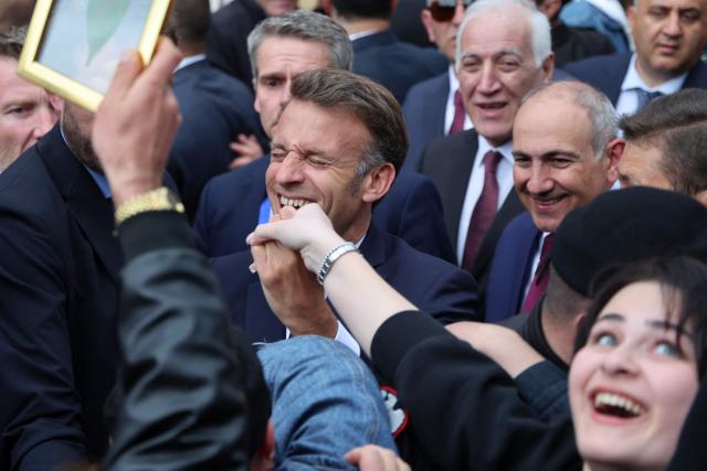 France's President Emmanuel Macron is greeted by people in Gyumri on May 5, 2026. (Photo by Ludovic MARIN / AFP)