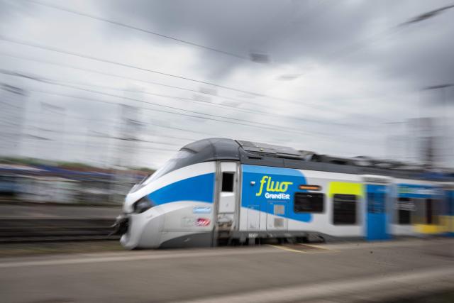 This photograph shows a Regional Express Train (TER FLUO) of the Grand Est region network locomoting through the city of Strasbourg, eastern France on May 5, 2026. (Photo by SEBASTIEN BOZON / AFP)