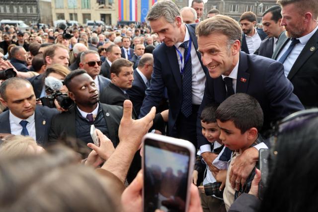 France's President Emmanuel Macron is greeted by people in Gyumri on May 5, 2026. (Photo by Ludovic MARIN / AFP)