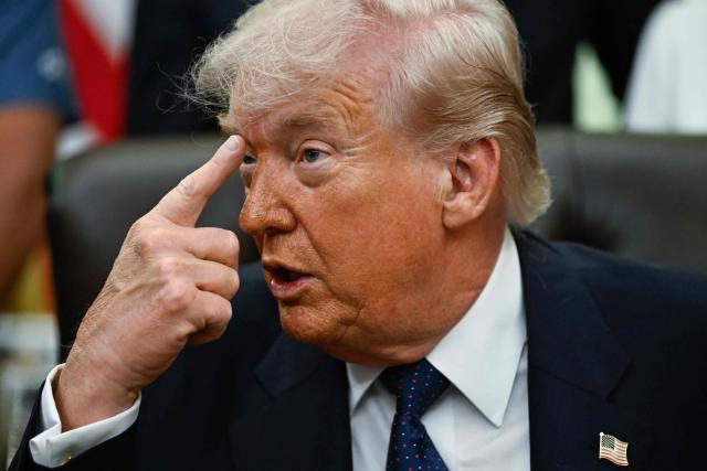 US President Donald Trump gestures as he speaks before signing a proclamation to revive the Presidential Fitness Test Award, a competitive school-based fitness program, in the Oval Office of the White House in Washington, DC on May 5, 2026. (Photo by Kent NISHIMURA / AFP)