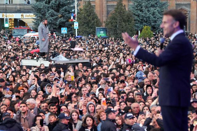 France's President Emmanuel Macron acknowledges the crowd after a concert before leaving Gyumri on May 5, 2026. (Photo by Ludovic MARIN / AFP)
