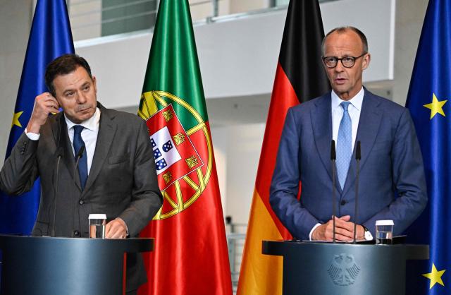 German Chancellor Friedrich Merz and Portuguese Prime Minister Luis Montenegro give a joint press conference at the Chancellery in Berlin on May 5, 2026. (Photo by Tobias SCHWARZ / AFP)