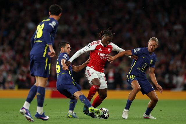 Arsenal's English midfielder #10 Eberechi Eze is put under pressure by Atletico Madrid's Spanish midfielder #06 Koke (2L) and Atletico Madrid's Spanish midfielder #14 Marcos Llorente during the UEFA Champions League second-leg semi-final football match between Arsenal and Atletico Madrid at the Emirates Stadium in north London on May 5, 2026. (Photo by Adrian Dennis / AFP)