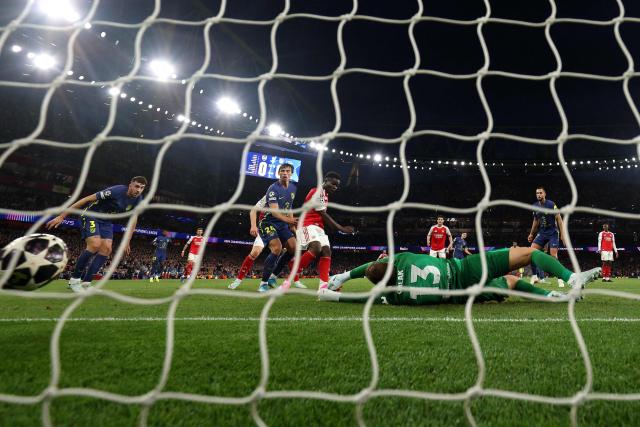 Arsenal's English midfielder #07 Bukayo Saka scores the team's first goal during the UEFA Champions League second-leg semi-final football match between Arsenal and Atletico Madrid at the Emirates Stadium in north London on May 5, 2026. (Photo by Adrian DENNIS / AFP)