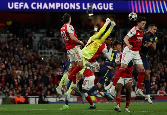 Arsenal's Spanish goalkeeper #01 David Raya punches the ball away during the UEFA Champions League second-leg semi-final football match between Arsenal and Atletico Madrid at the Emirates Stadium in north London on May 5, 2026. (Photo by Adrian Dennis / AFP)