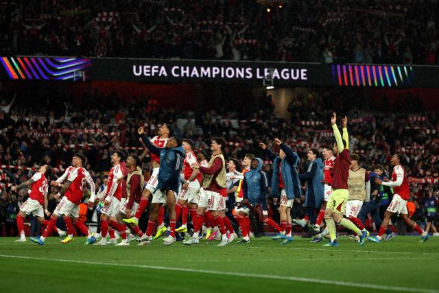 Arsenal players celebrate winning the UEFA Champions League second-leg semi-final football match between Arsenal and Atletico Madrid at the Emirates Stadium in north London on May 5, 2026. (Photo by Adrian Dennis / AFP)