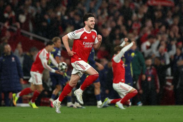 Arsenal's English midfielder #41 Declan Rice celebrates winning the UEFA Champions League second-leg semi-final football match between Arsenal and Atletico Madrid at the Emirates Stadium in north London on May 5, 2026. (Photo by Adrian Dennis / AFP)