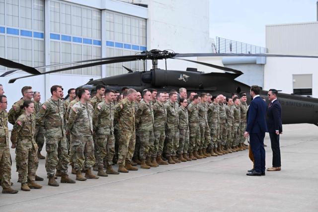 US Vice President JD Vance meets with members of Iowa National Guard Unit at Des Moines International Airport in Des Moines, Iowa, on May 5, 2026. Vance will speak at Ex-Guard Industries, a manufacturing facility, during a campaign event to support US Representative Zach Nunn, Republican from Iowa. (Photo by Roberto Schmidt / POOL / AFP)