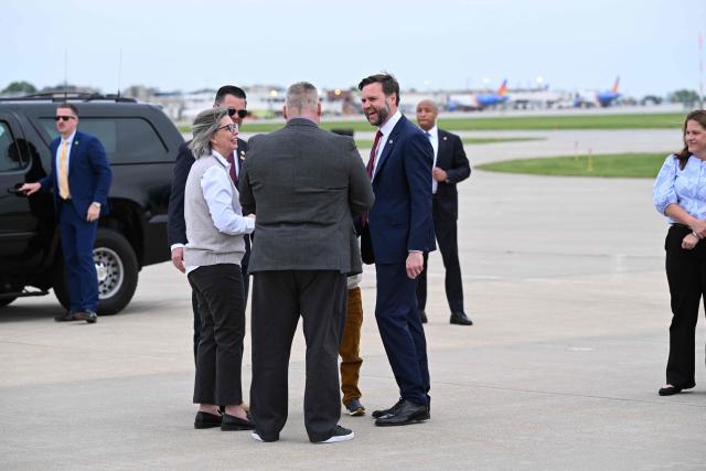 US Vice President JD Vance with his son Vivek by his side, speaks with a gold star family  upon arrival at Des Moines International Airport in Des Moines, Iowa, on May 5, 2026. Vance will speak at Ex-Guard Industries, a manufacturing facility, during a campaign event to support US Representative Zach Nunn, Republican from Iowa. (Photo by Roberto Schmidt / POOL / AFP)