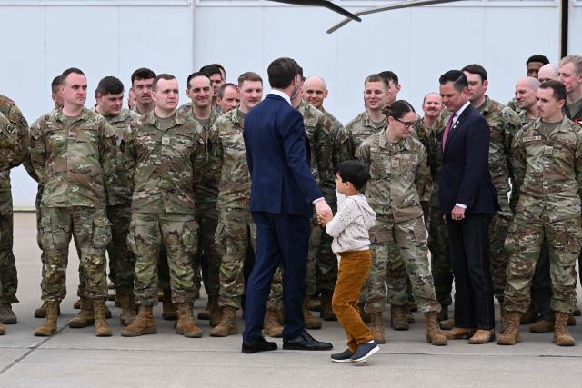 US Vice President JD Vance speaks with members of Iowa Army and Air National Guard at Des Moines International Airport in Des Moines, Iowa, on May 5, 2026. Vance will speak at Ex-Guard Industries, a manufacturing facility, during a campaign event to support US Representative Zach Nunn, Republican from Iowa. (Photo by Roberto Schmidt / POOL / AFP)